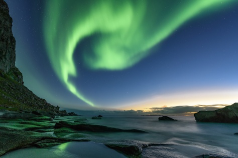 Northern lights about a beach in Lofoten islands, Norway
